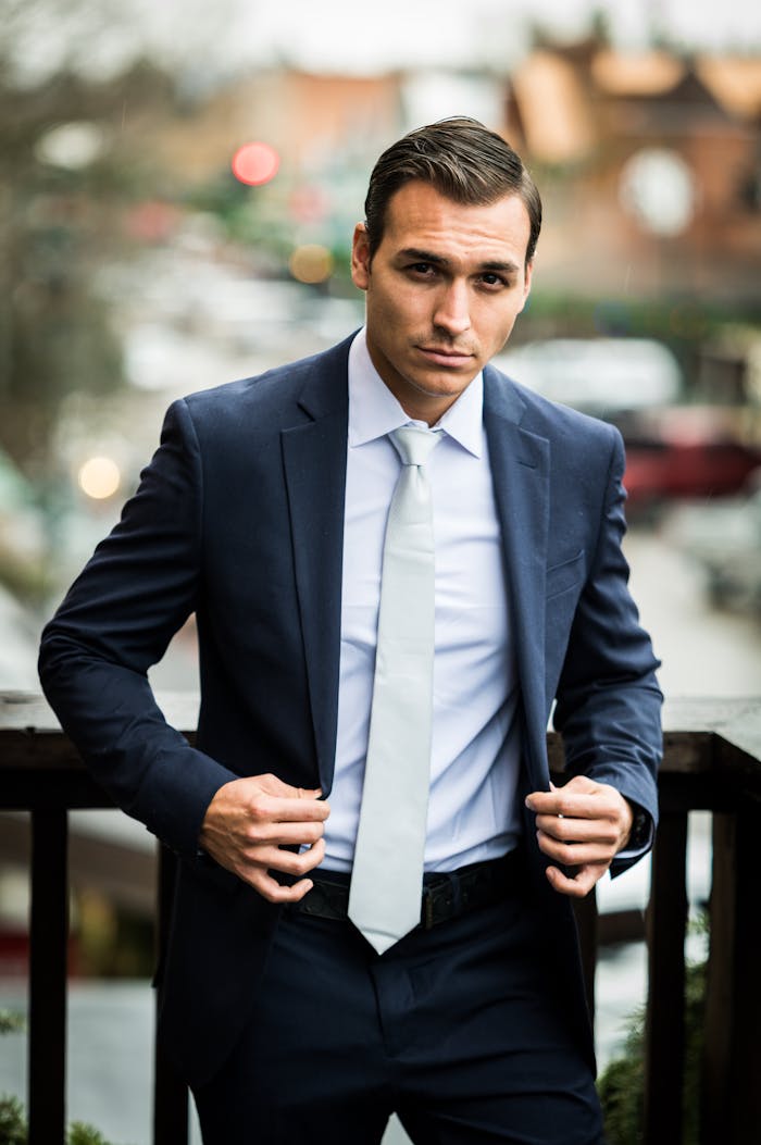 Man Walking and Fastening his Jacket