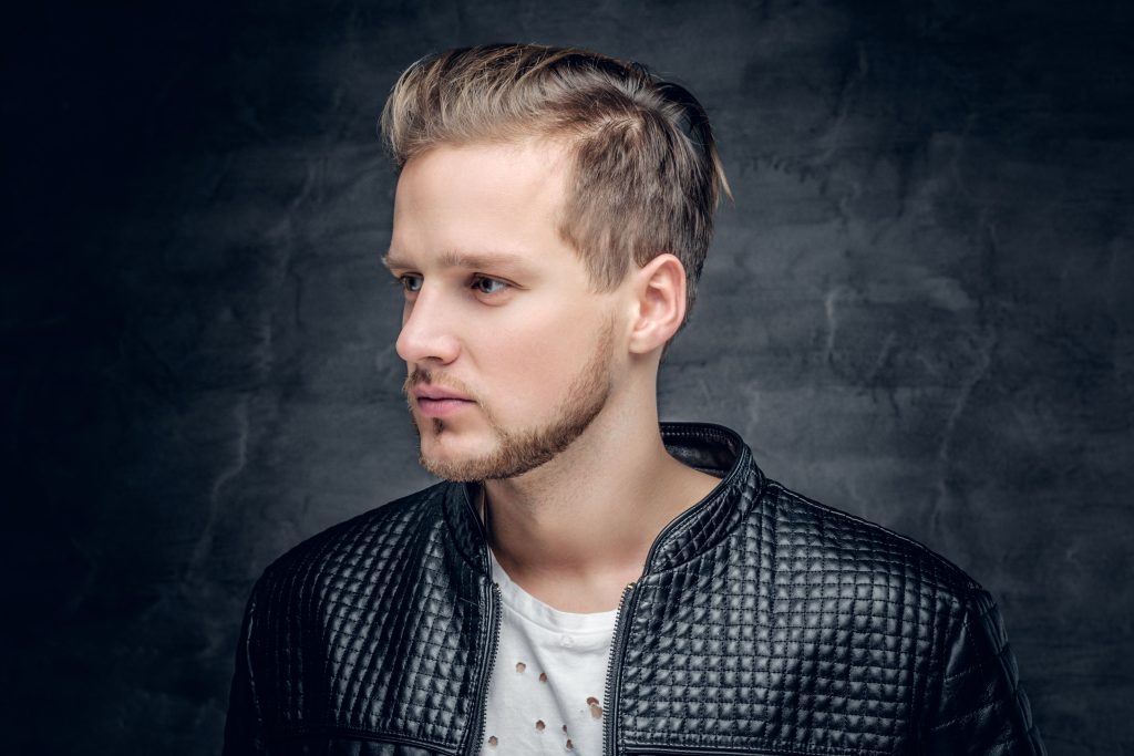 handsome man with receding hairline showing great hairstyle with faded sides and top length